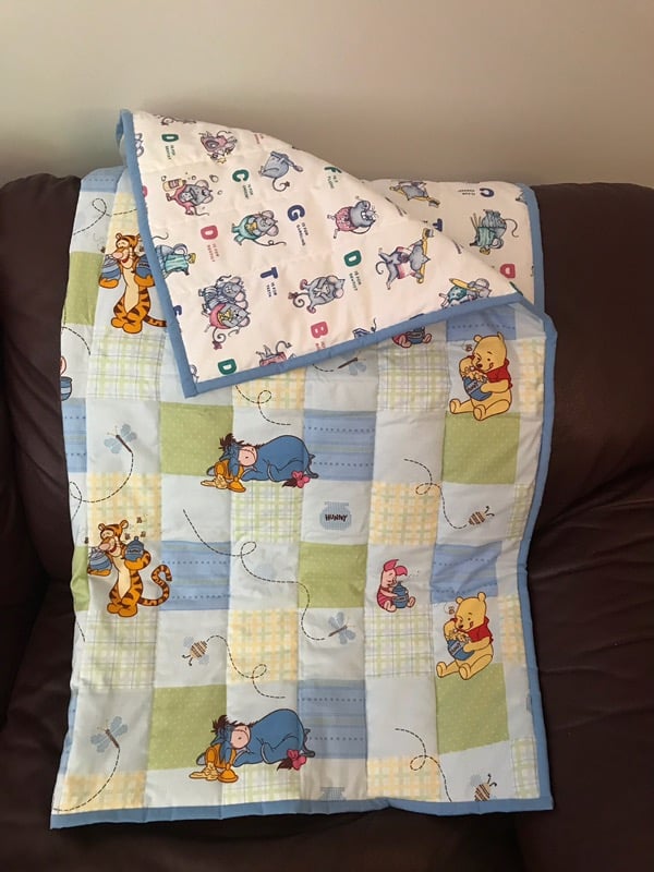 Baby This quilt is machine stitched and is the perfect gift for a child. Dimensions are 37" x 42" Starting bid is $50. Bid and view at Pinecroft, 8122 Rogers Rd, Aylmer, ON N5H 2R4