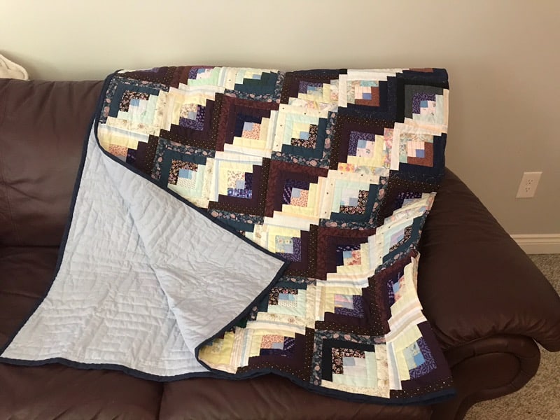 Log Cabin This quilt is hand stitched, log cabin style and is perfect to stay warm for the upcoming cold winter nights Dimensions are 82 x 82 Starting bid is $400. Bid and view at62 Talbot St E, Aylmer, ON N5H 1H4.