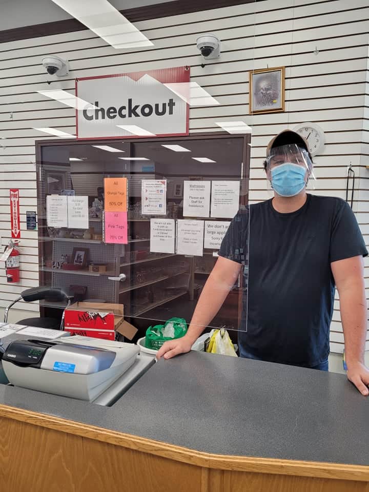 Ryan with Face shield at cash on Thrift Re-opening, June 11, 2021
